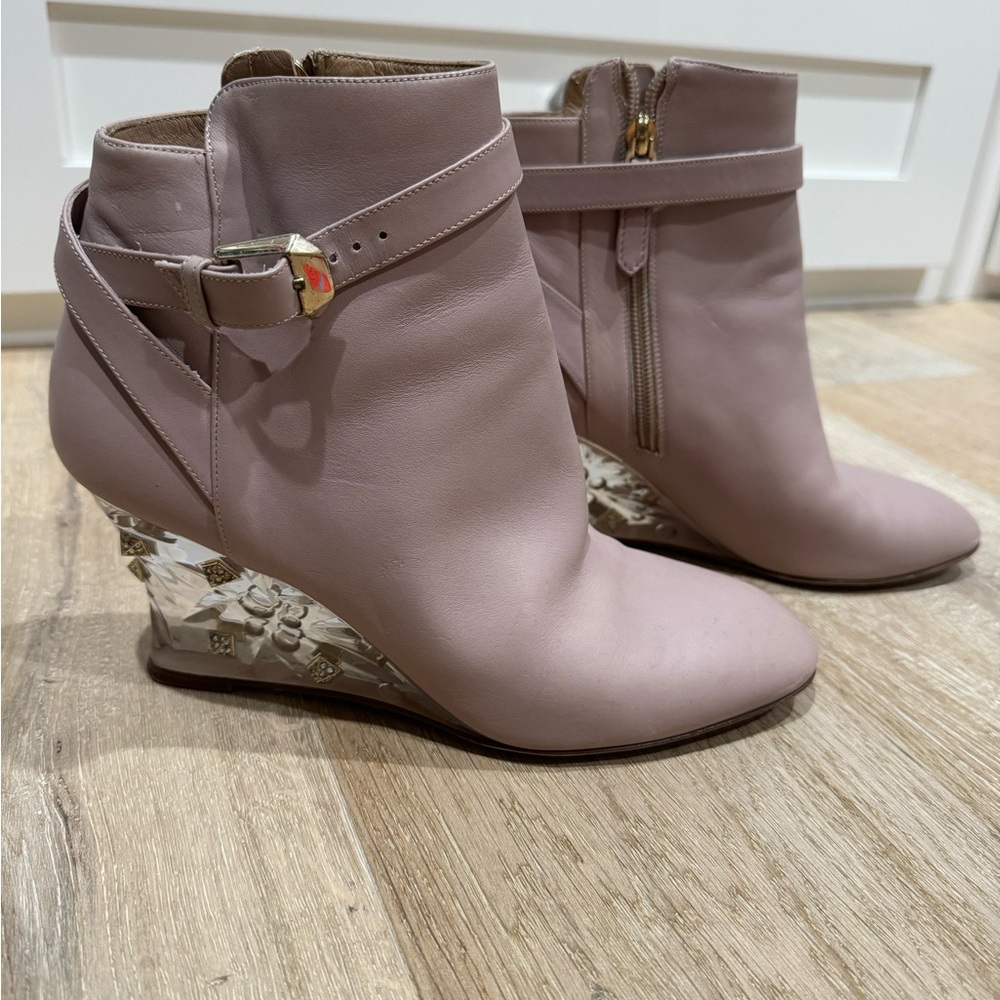Tan booties with detailed heel and zippered side